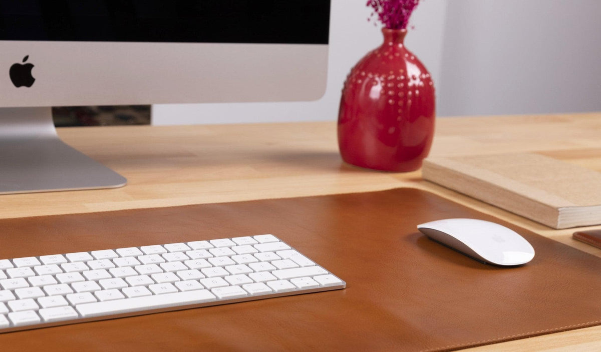 Full-grain leather desk mat in a workspace